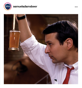 Jim Koch inspecting glass of beer