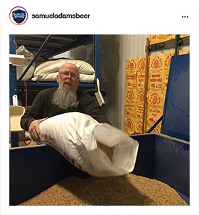 Brewer adding ingredients